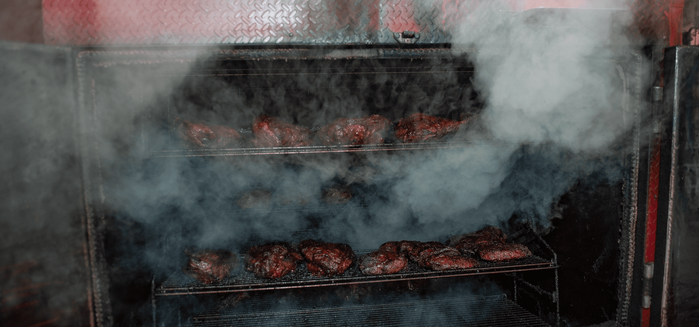 smoky Smoke pouring out of a grill