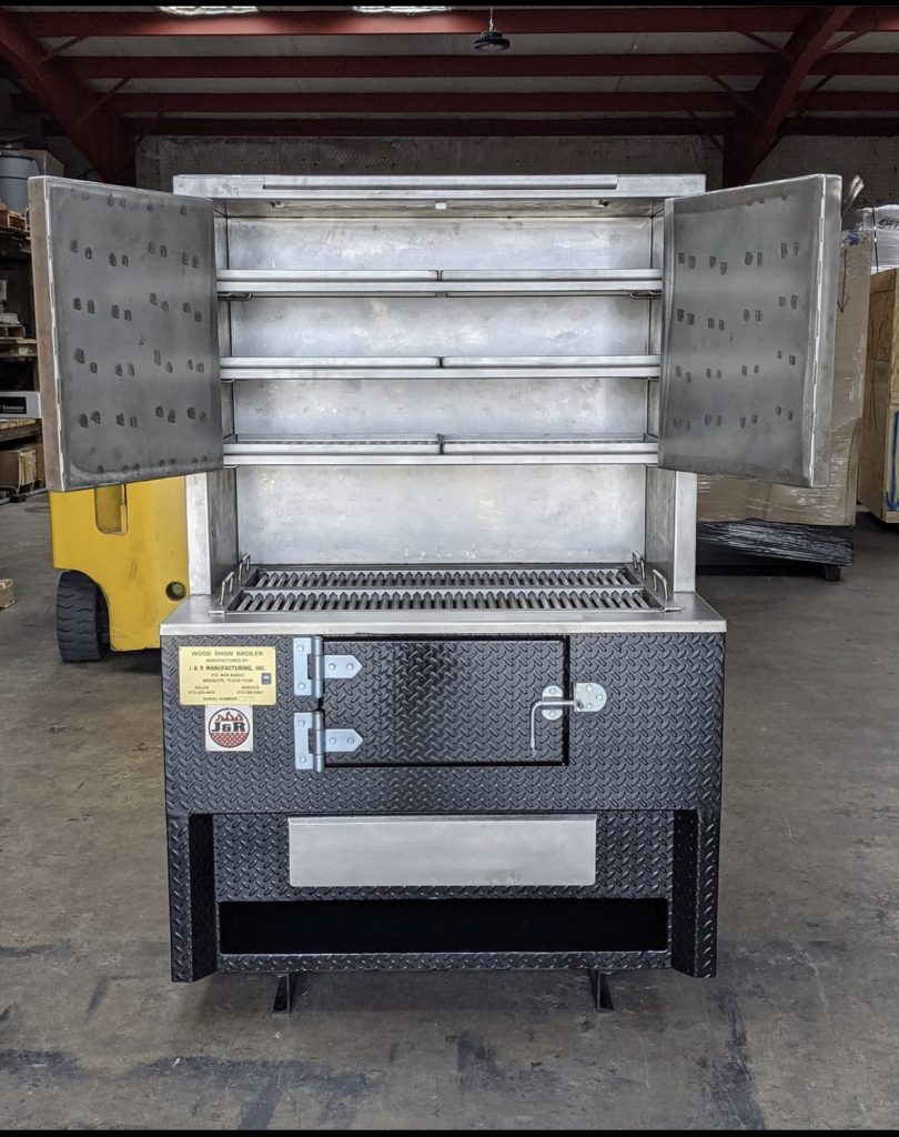 Vertical smoker with top doors opened showing racks inside